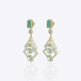 14K gold earrings with a geometric, fluid design