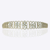 14K gold choker with delicate floral motif in a sleek oval design
