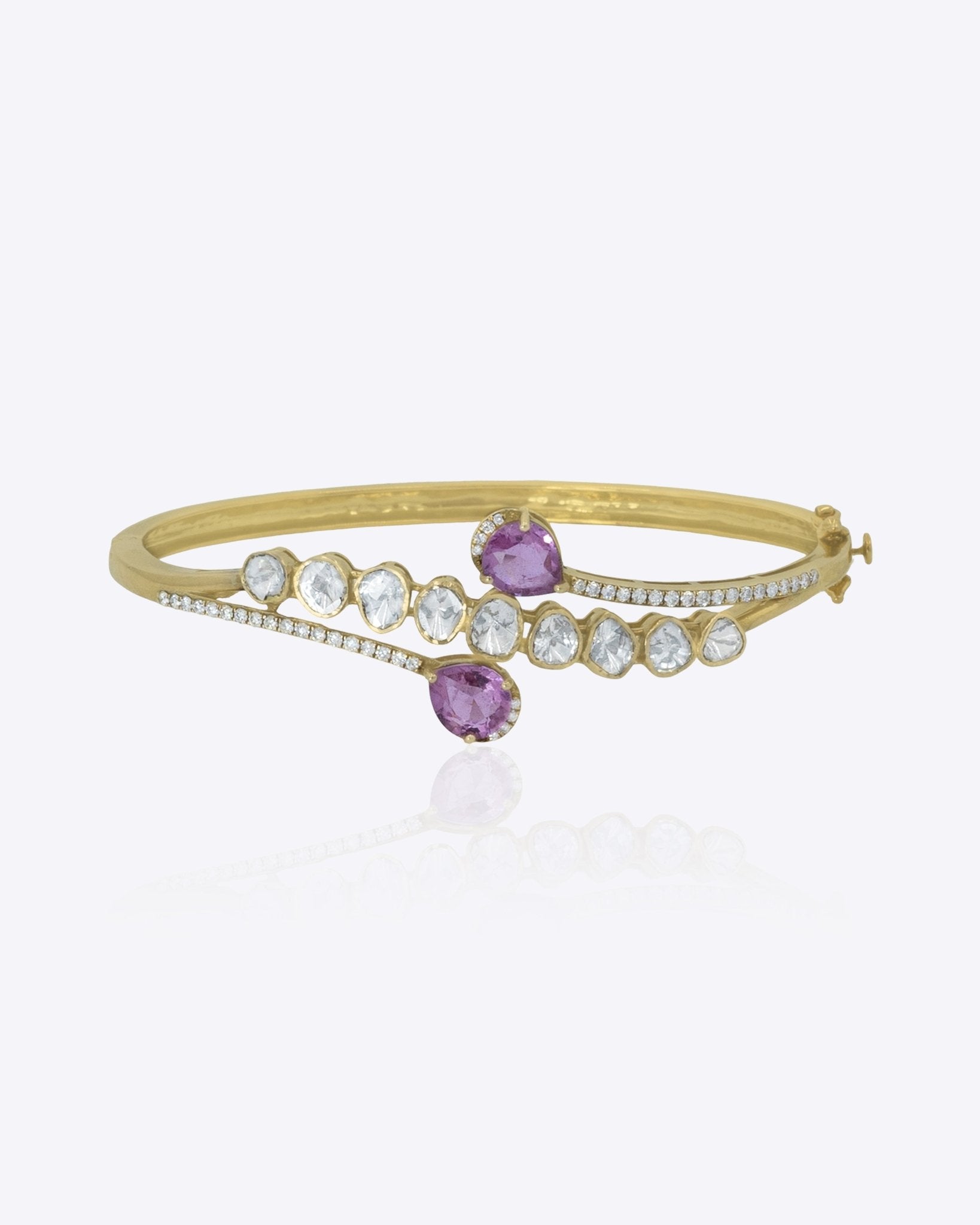 Rosette Curve Bangle in 14K gold with a soft curved silhouette and diamond accents