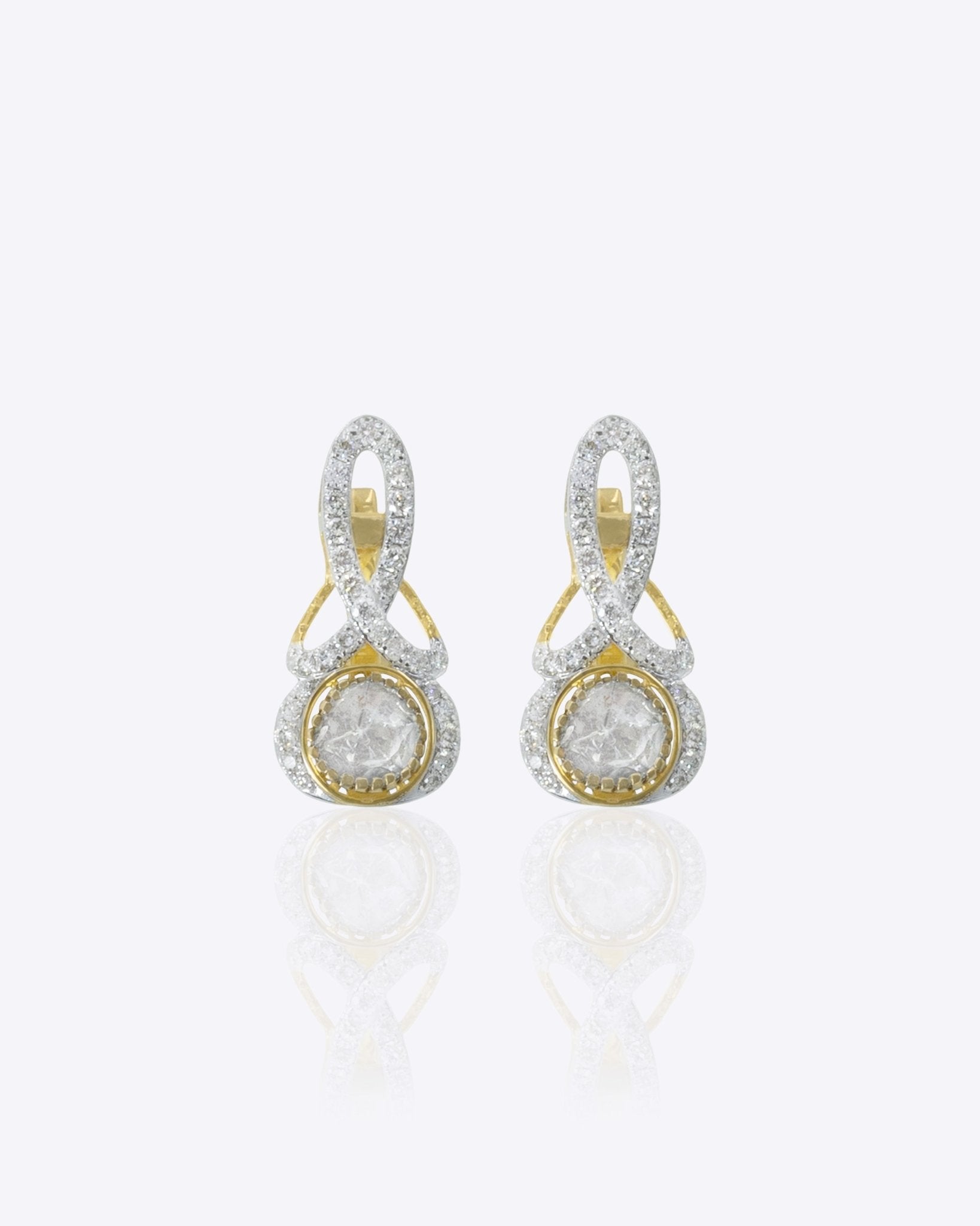 Ribbon Curve Hoops in 14K gold with a smooth, flowing ribbon silhouette