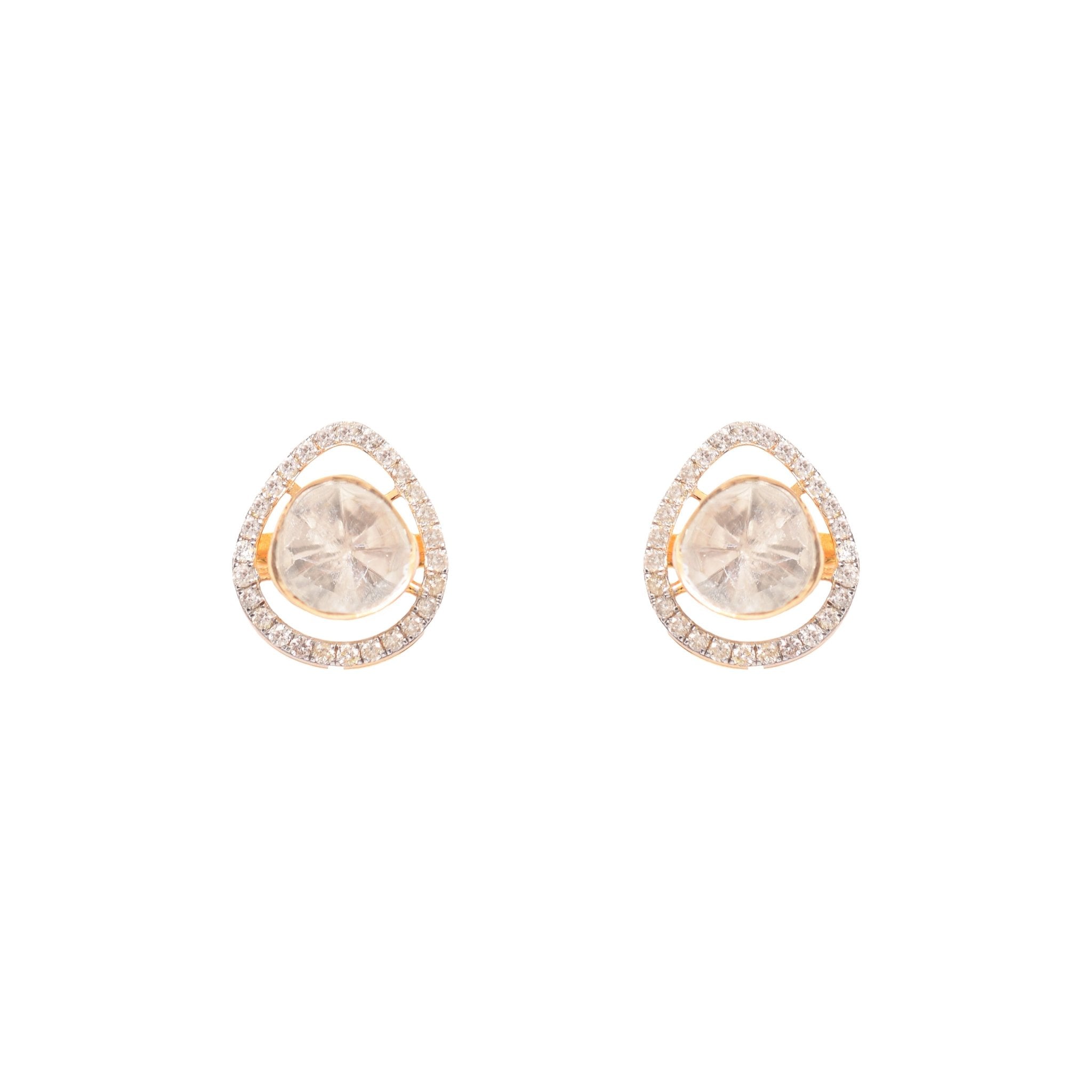 Glowing polki diamond studs styled on ear, reflecting effulgent radiance in close detail.