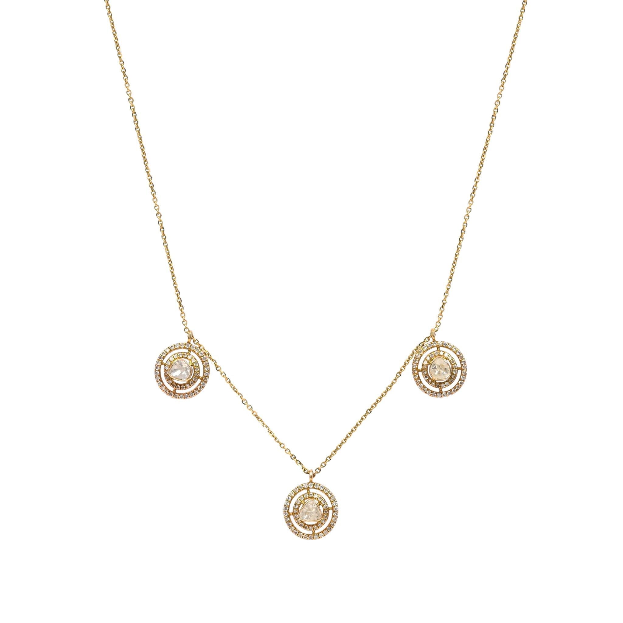 Trio necklace close-up on model featuring triple charm Polki elegance