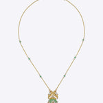 Sky Monarch Pendant in 14k gold with sculpted wings and an emerald-embellished chain