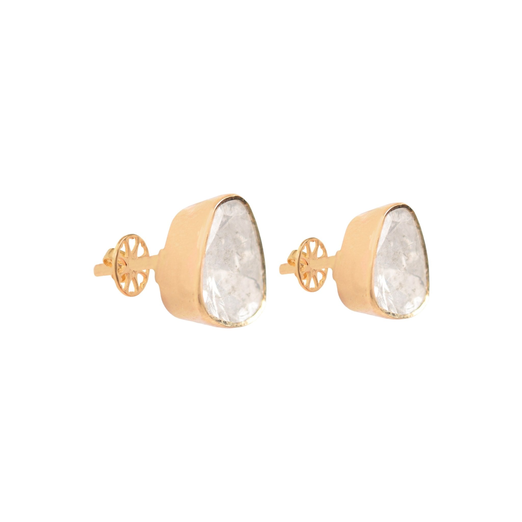 Soft ear close-up showing dainty polki studs styled with quiet sophistication.