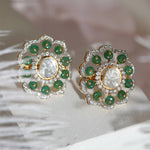 14K gold floral drop earrings set with Polki diamonds and emerald accents.