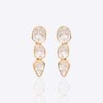 14K gold minimal dangler earrings with three vertically linked Polki diamonds.