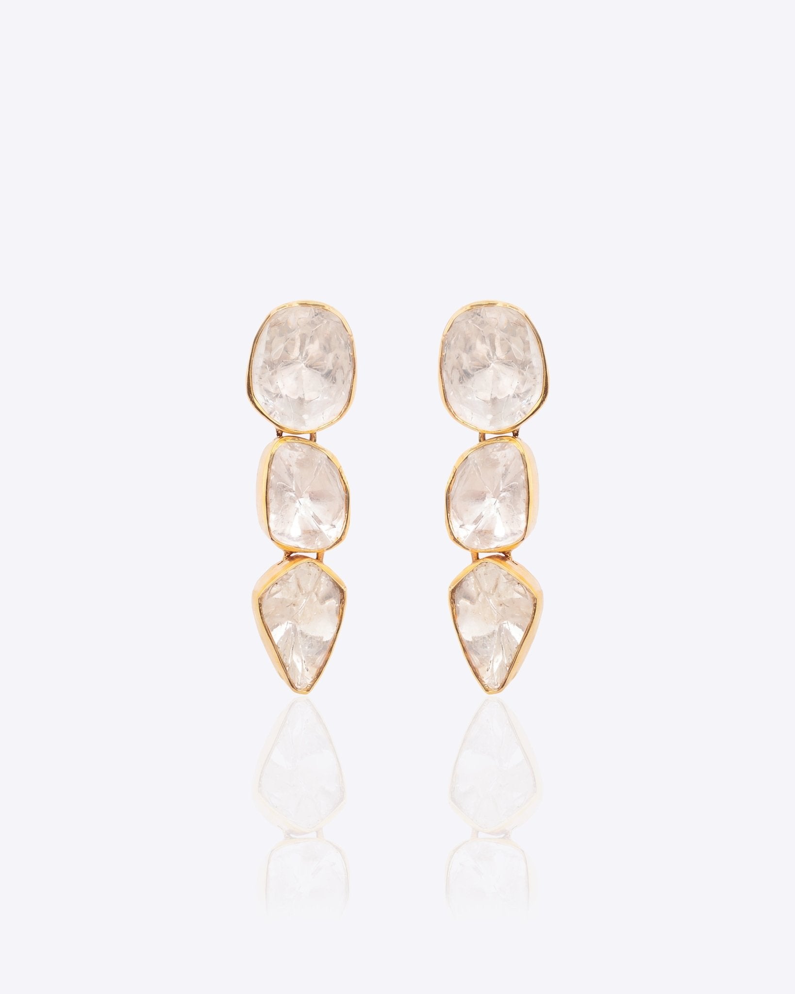 14K gold minimal dangler earrings with three vertically linked Polki diamonds.