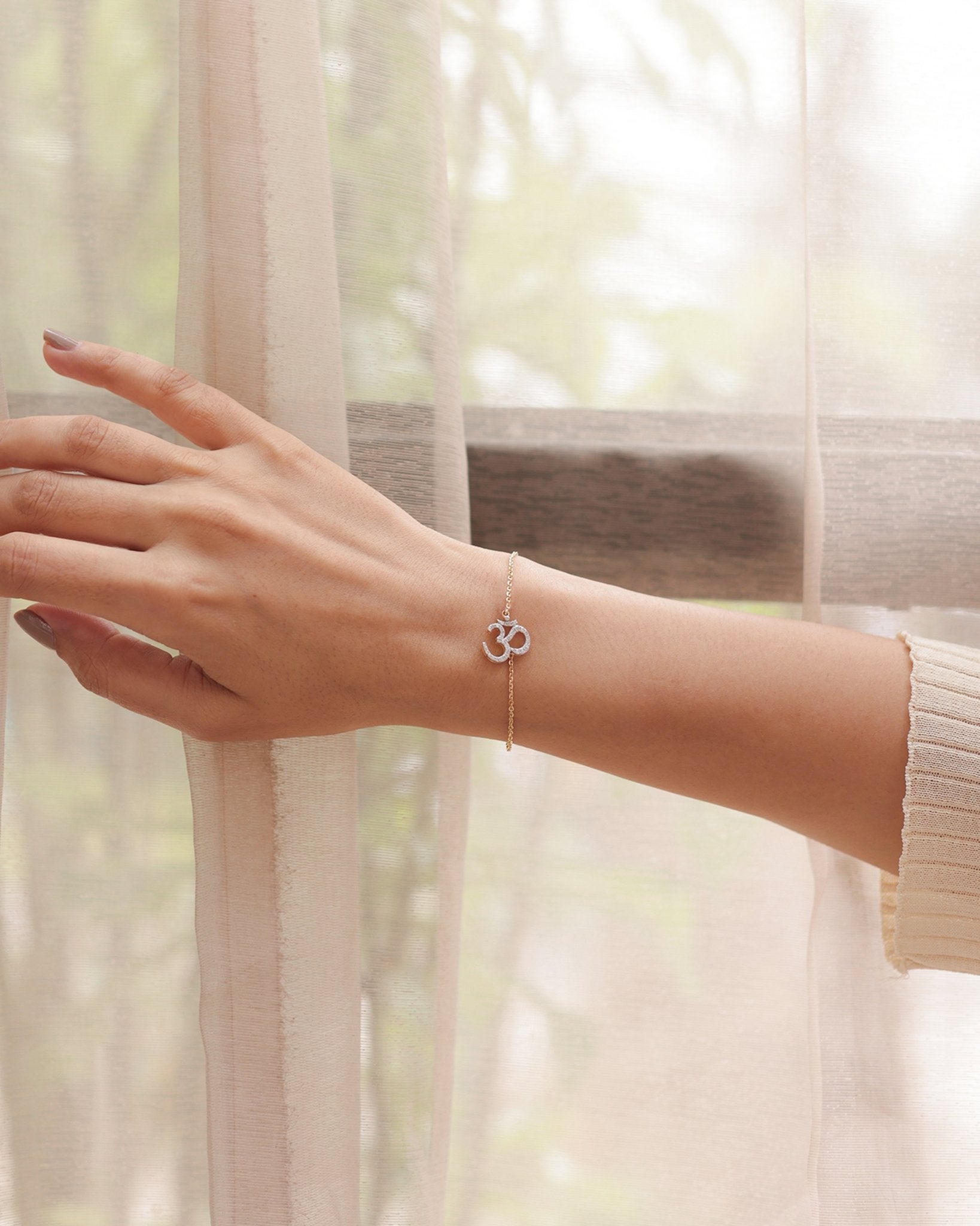 Veer Diamond Bracelet in 14K gold with Om motif and Polki diamond detailing.
