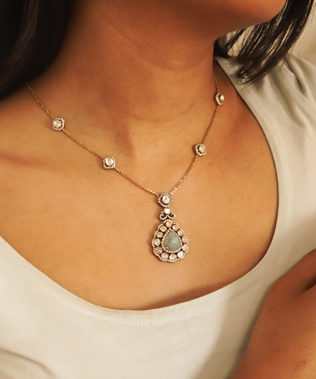 Aquamarine Petal Waters necklace gracing the model’s neckline, fused with polki diamonds