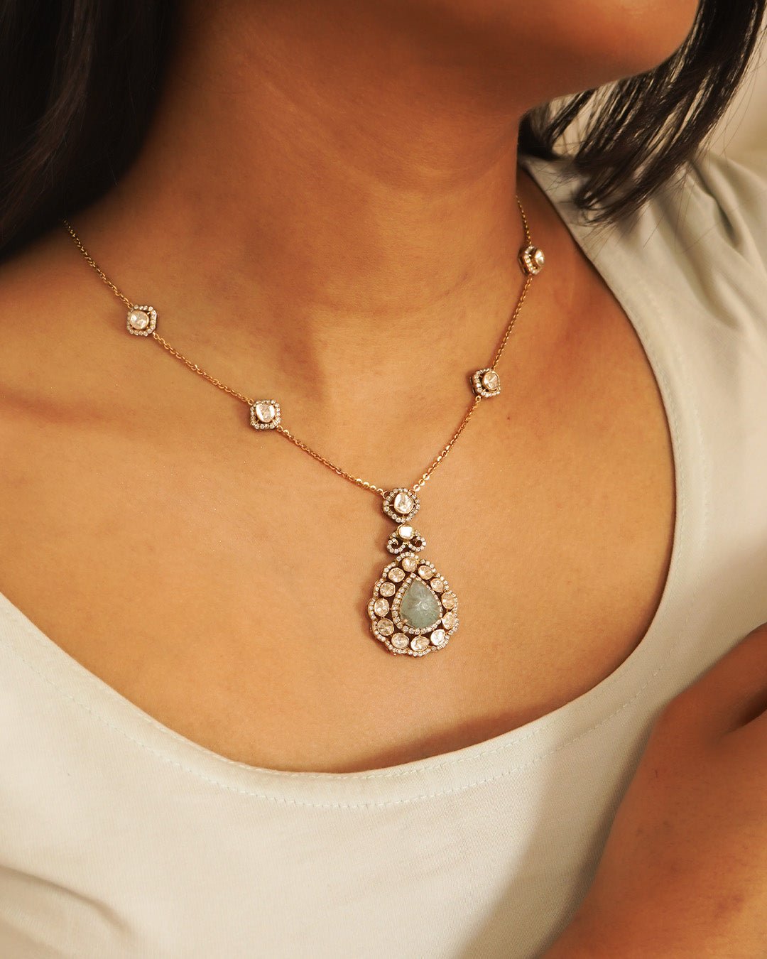 Aquamarine Petal Waters necklace gracing the model’s neckline, fused with polki diamonds