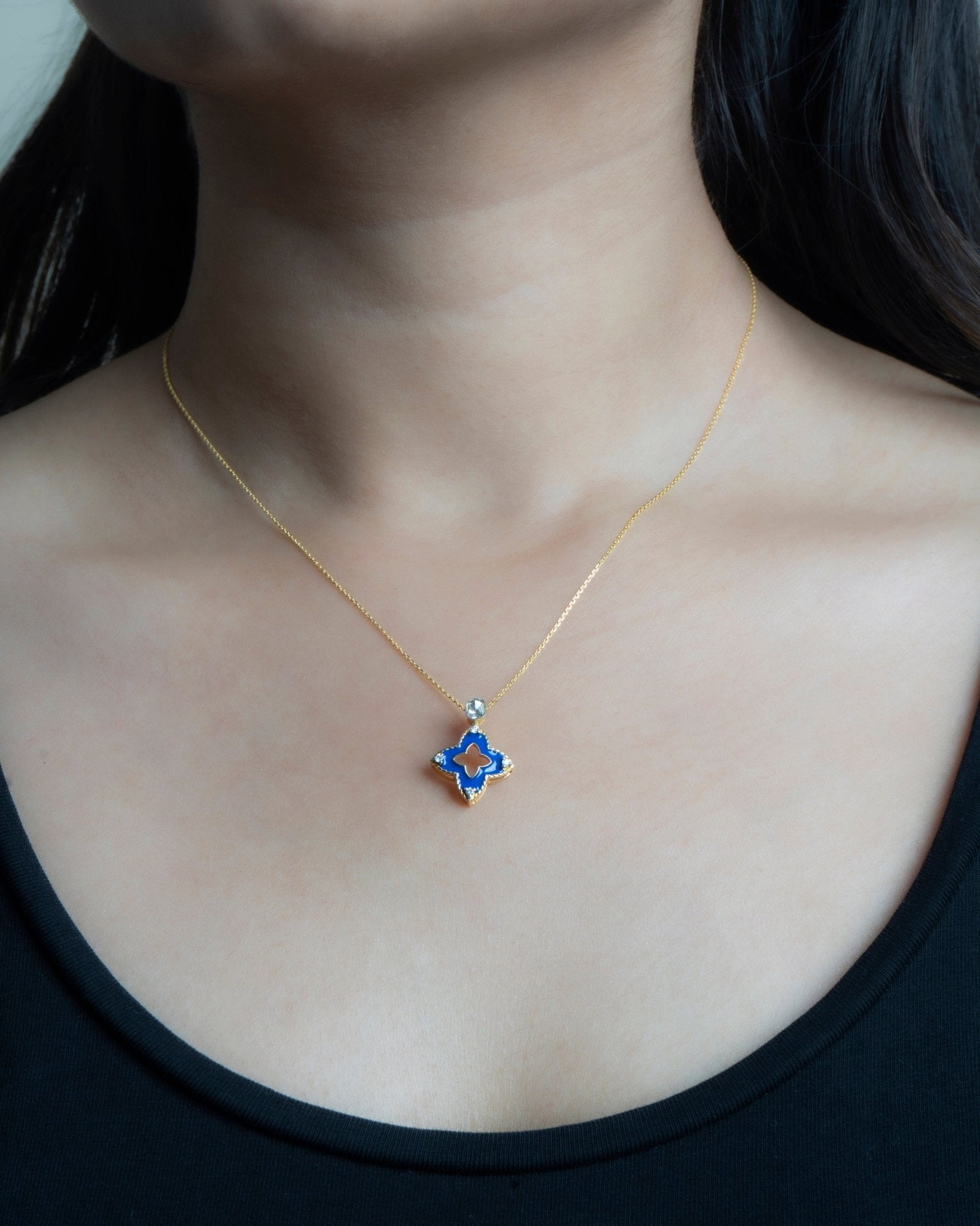 9kt gold pendant with deep blue enamel in a delicate charm shape