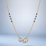 14K gold mangalsutra with round and oval Polki charms