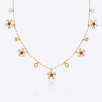 Floral Whisper Necklace in 14K gold with ruby-centred florals and Polki drops.