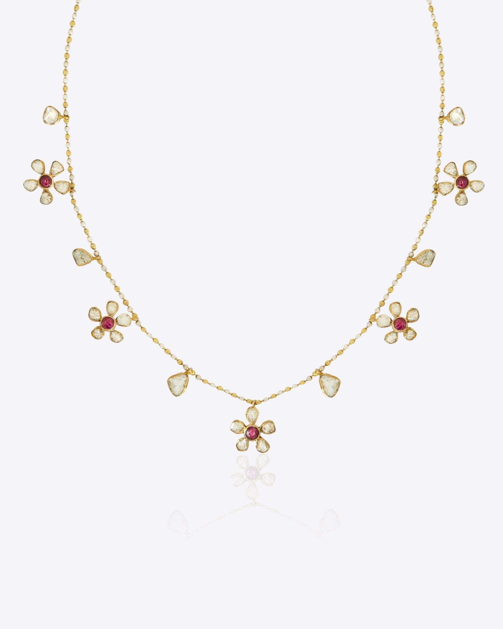 Floral Whisper Necklace in 14K gold with ruby-centred florals and Polki drops.