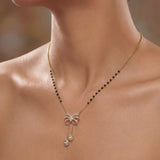 14K gold mangalsutra with Polki detailing and onyx accents