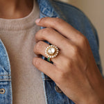Sunburst Polki Ring in 14K gold with a central Polki halo of Zambian emeralds.