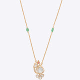 14k gold pendant with a delicate Polki peacock motif.