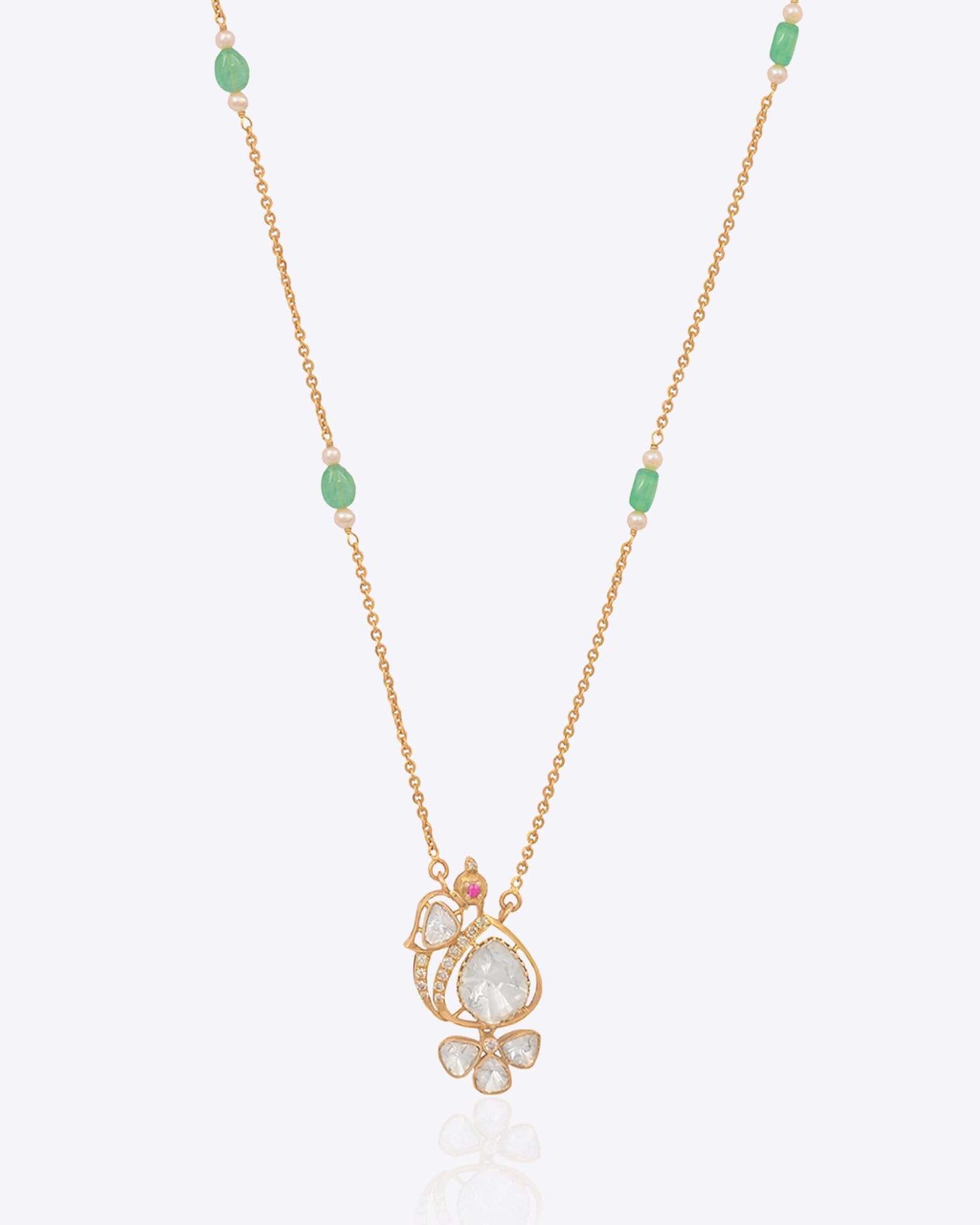 14k gold pendant with a delicate Polki peacock motif.