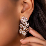 Sundown Flora Earrings in 18K gold with central Polki encircled by diamonds.