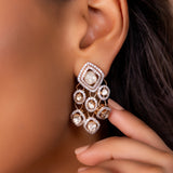 Sundown Flora Earrings in 18K gold with central Polki encircled by diamonds.