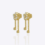 14K gold drop earrings with pear-shaped stones and knot motif