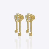 14K gold drop earrings with pear-shaped stones and knot motif