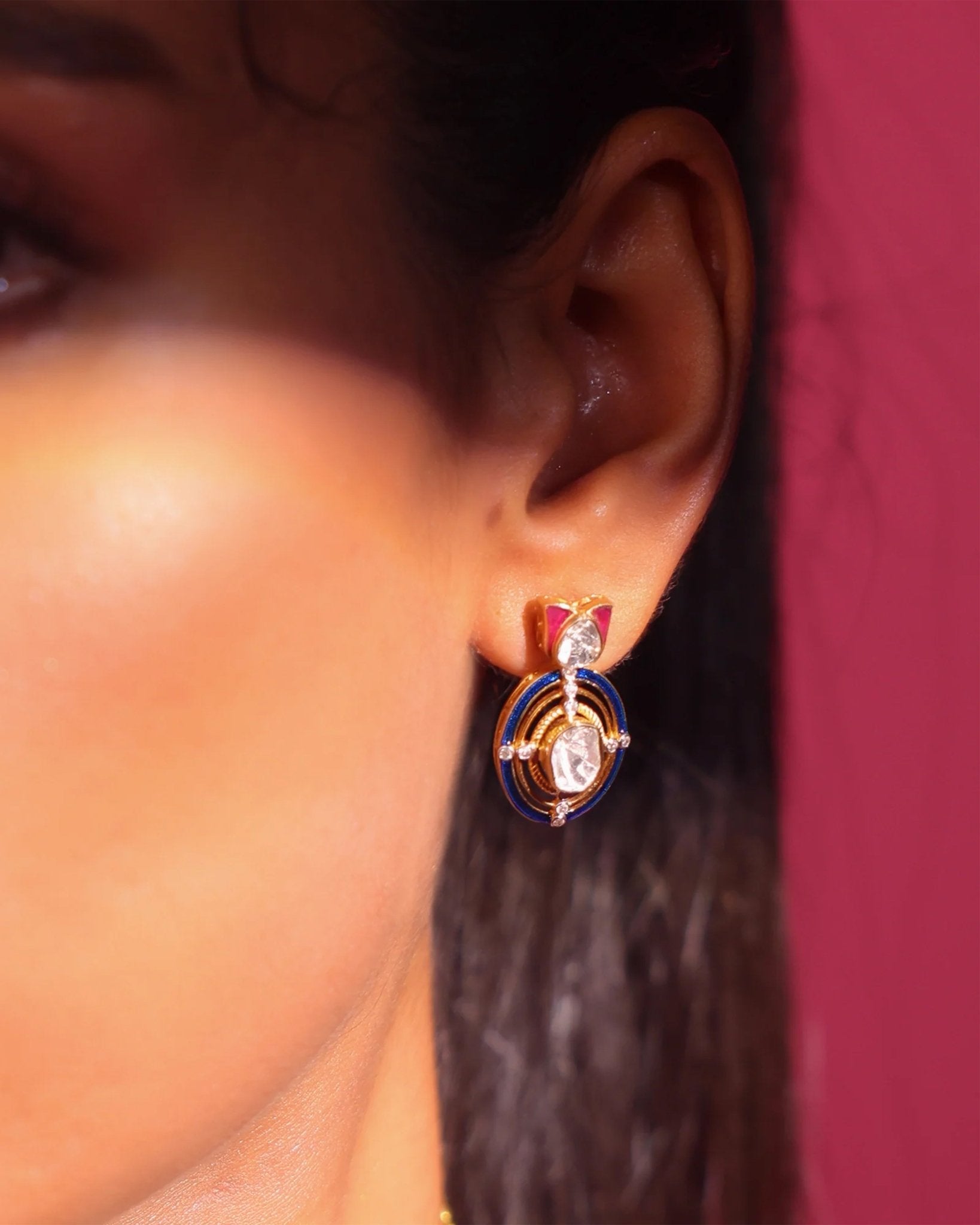 Radiant Polki diamond earrings in 18K gold with talaf stone framing.