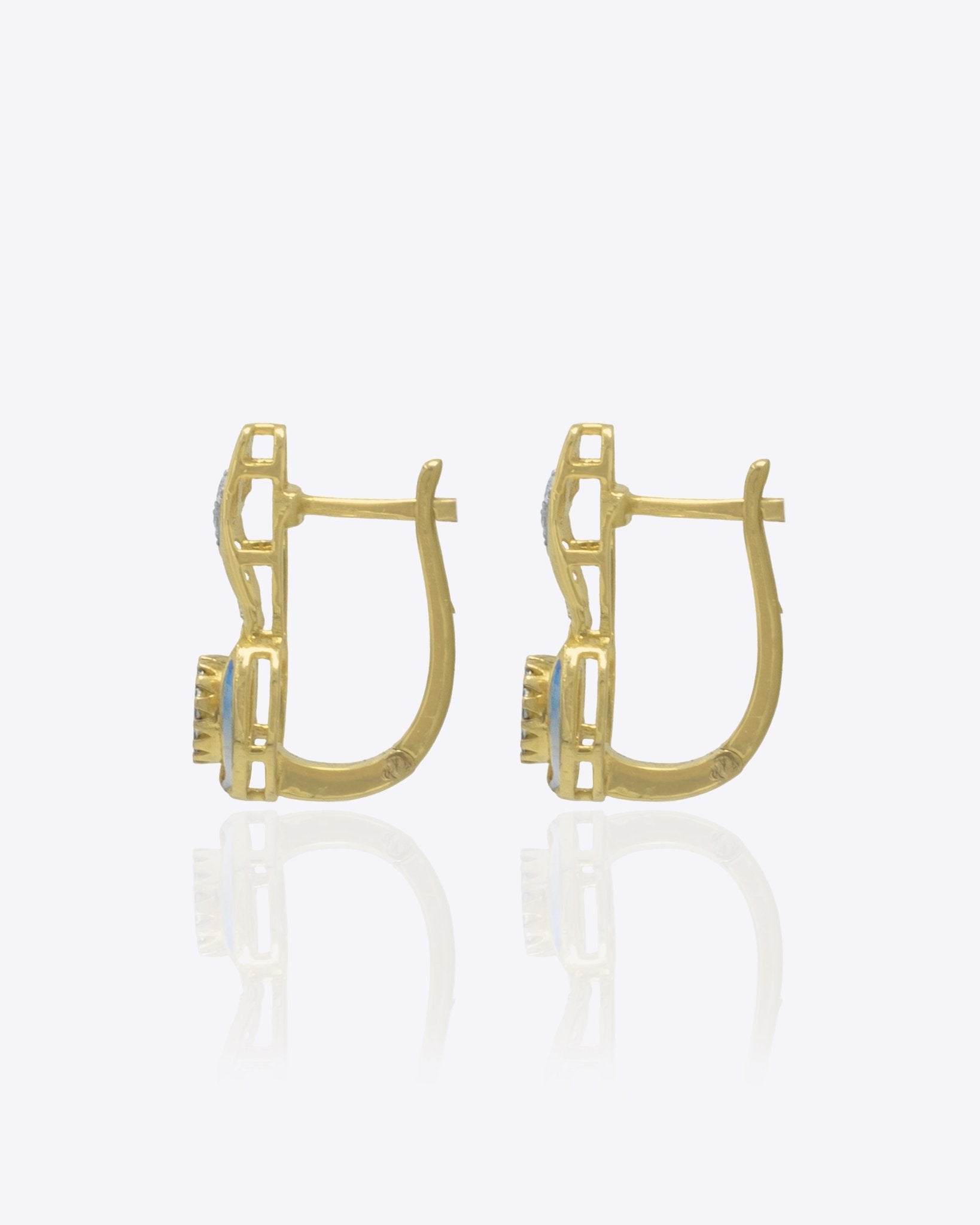 Seren Arc Earrings in 14K gold with a diamond and polished-gold curved design