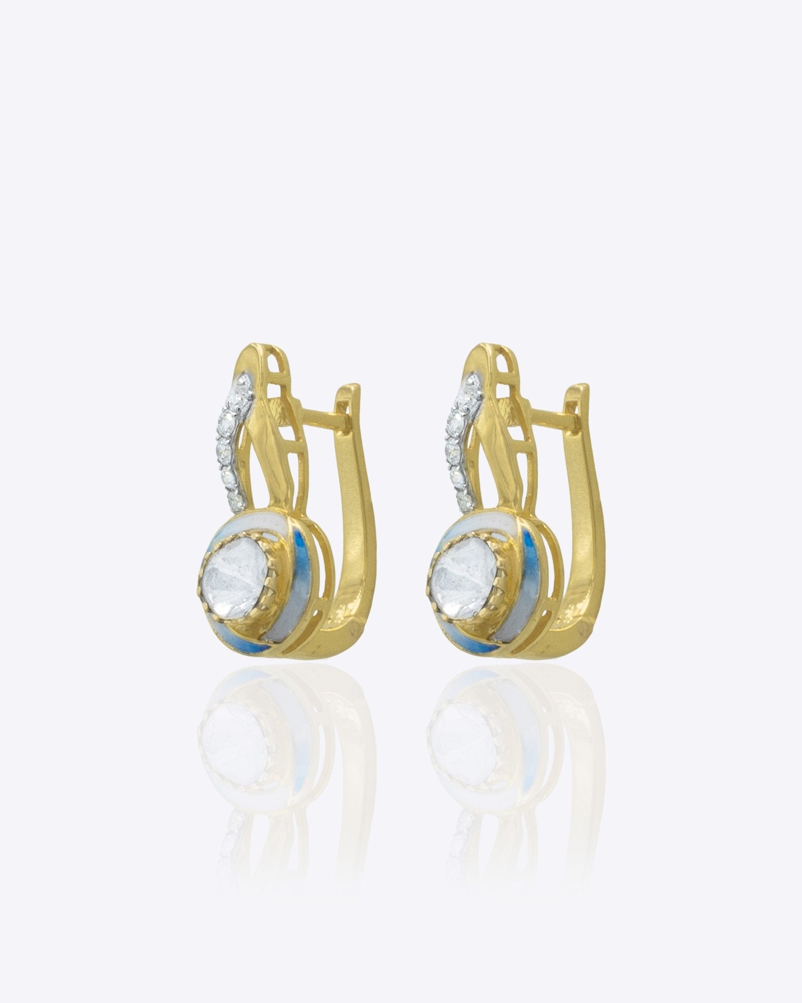 Seren Arc Earrings in 14K gold with a diamond and polished-gold curved design