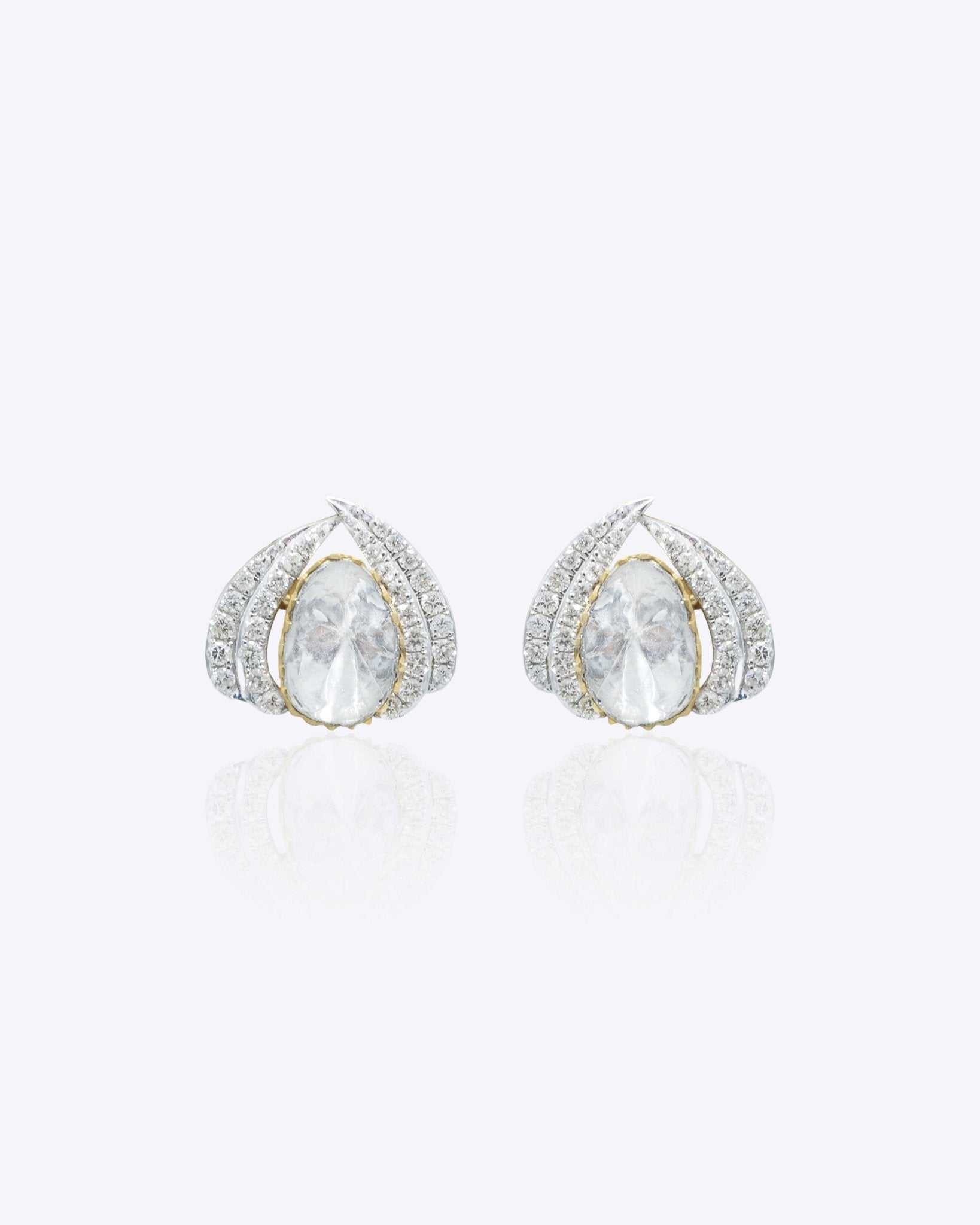 14k gold earrings with an oval Polki centerpiece