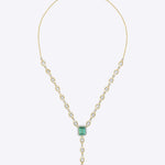 14K gold Oculis necklace with a central green stone and stacked Polki.