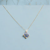 9kt gold pendant with deep blue enamel in a delicate charm shape