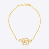 Swastik Sutra Bracelet in 14K gold with a Polki and diamond-outlined Swastik motif.