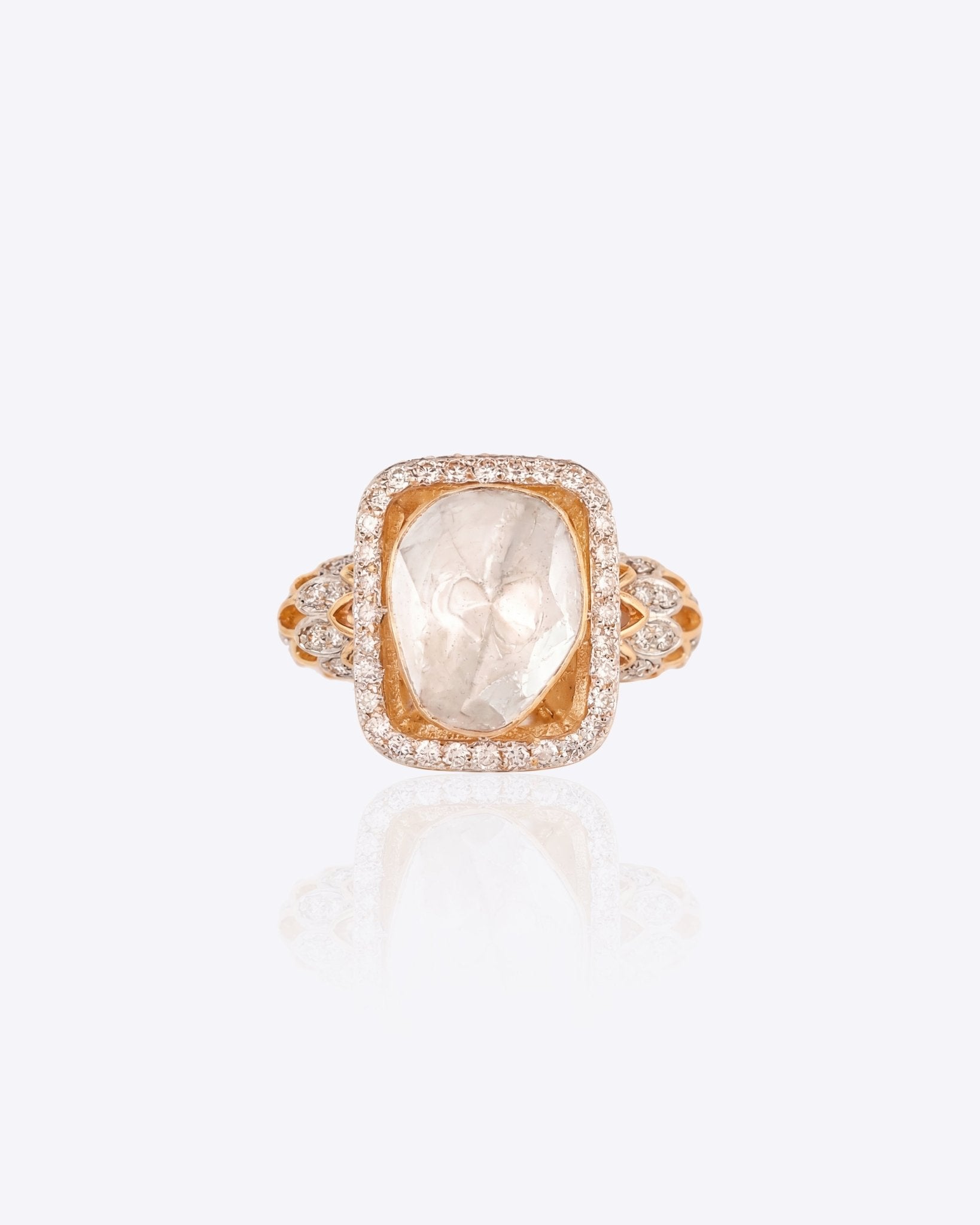 18K gold Ornate Polki Ring with an uncut diamond and intricate engravings.