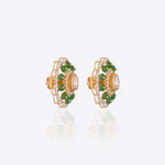 14K gold floral drop earrings set with Polki diamonds and emerald accents.