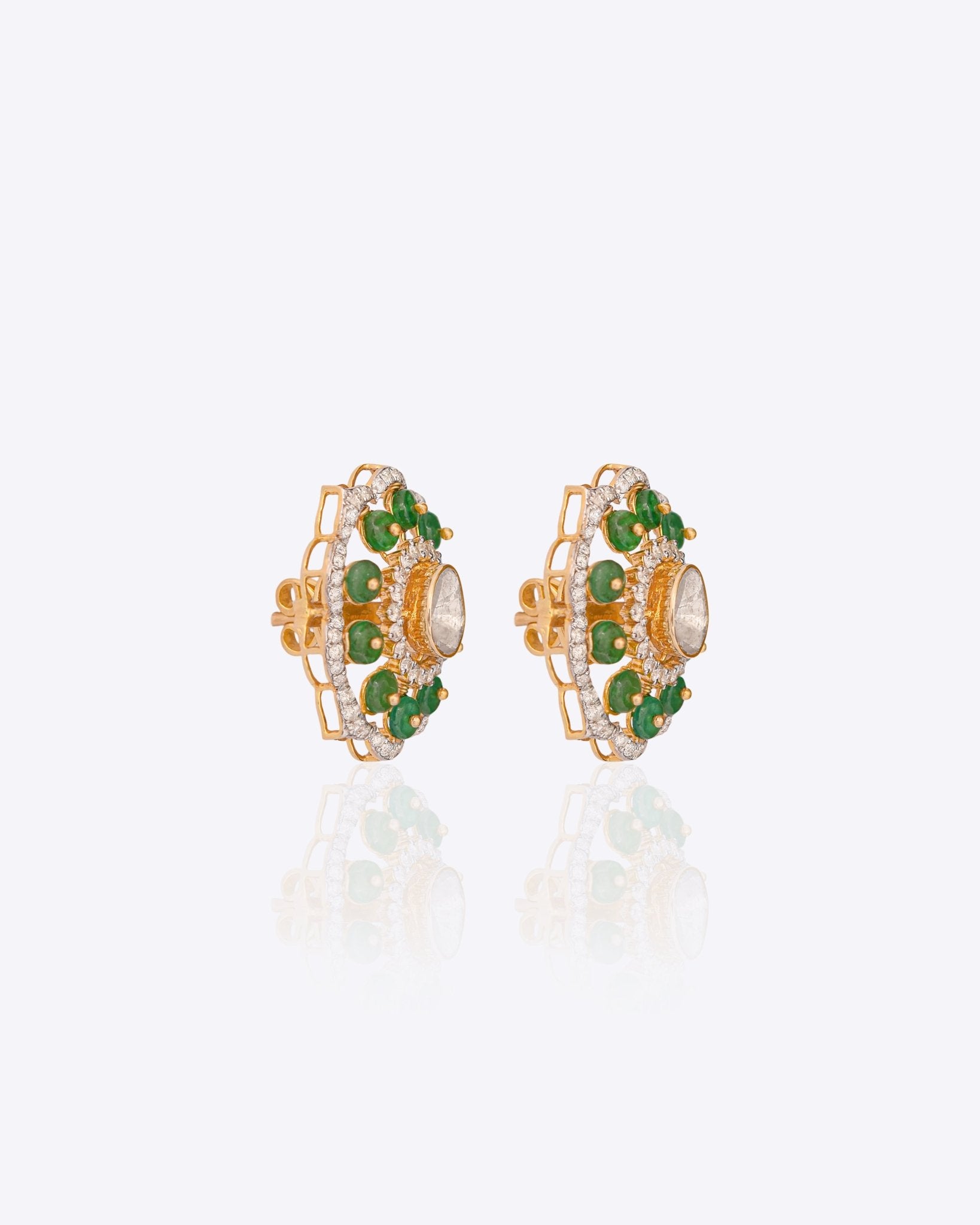 14K gold floral drop earrings set with Polki diamonds and emerald accents.