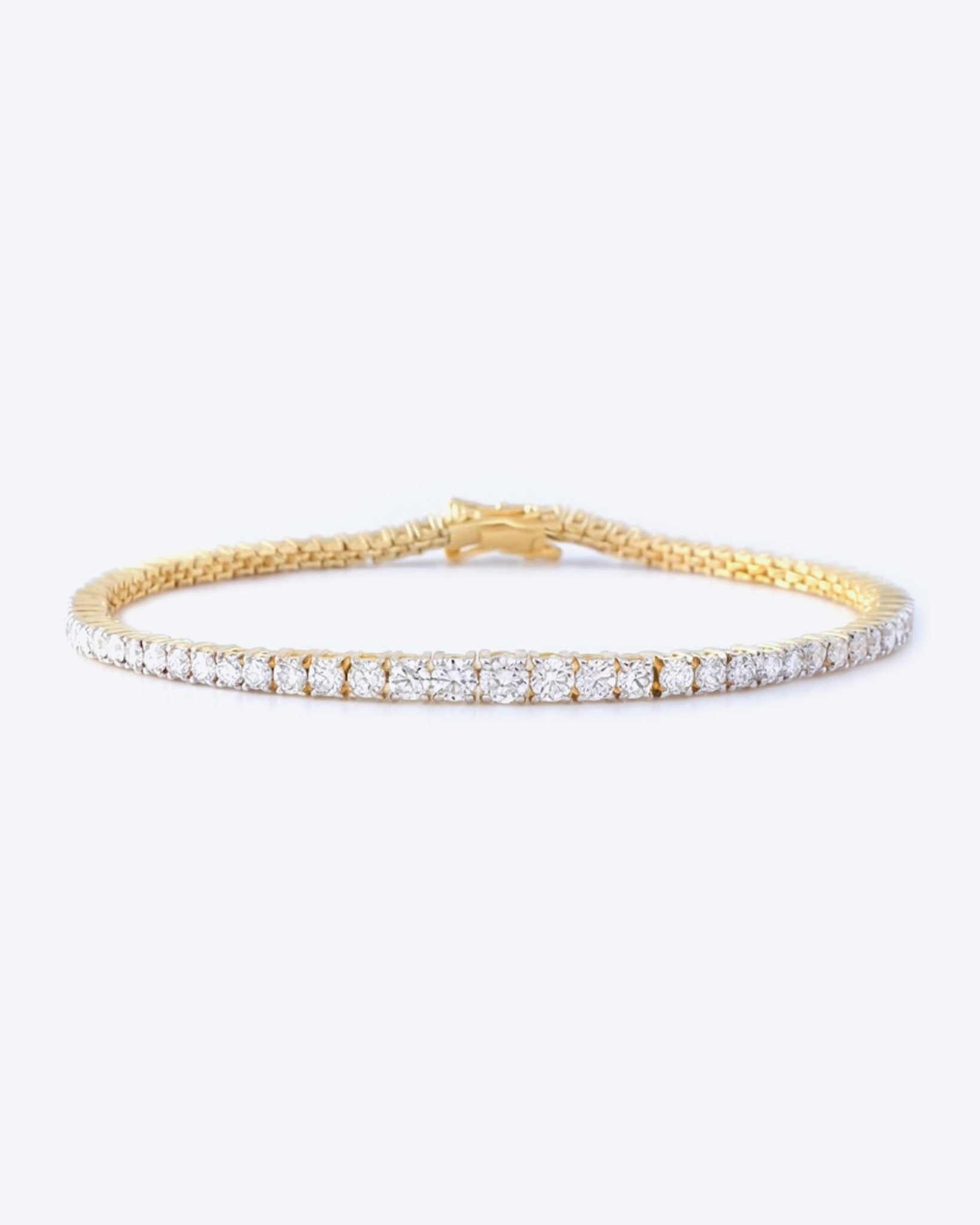 14k gold tennis bracelet with a continuous row of diamonds