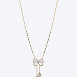 14K gold mangalsutra with Polki detailing and onyx accents