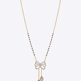 14K gold mangalsutra with Polki detailing and onyx accents