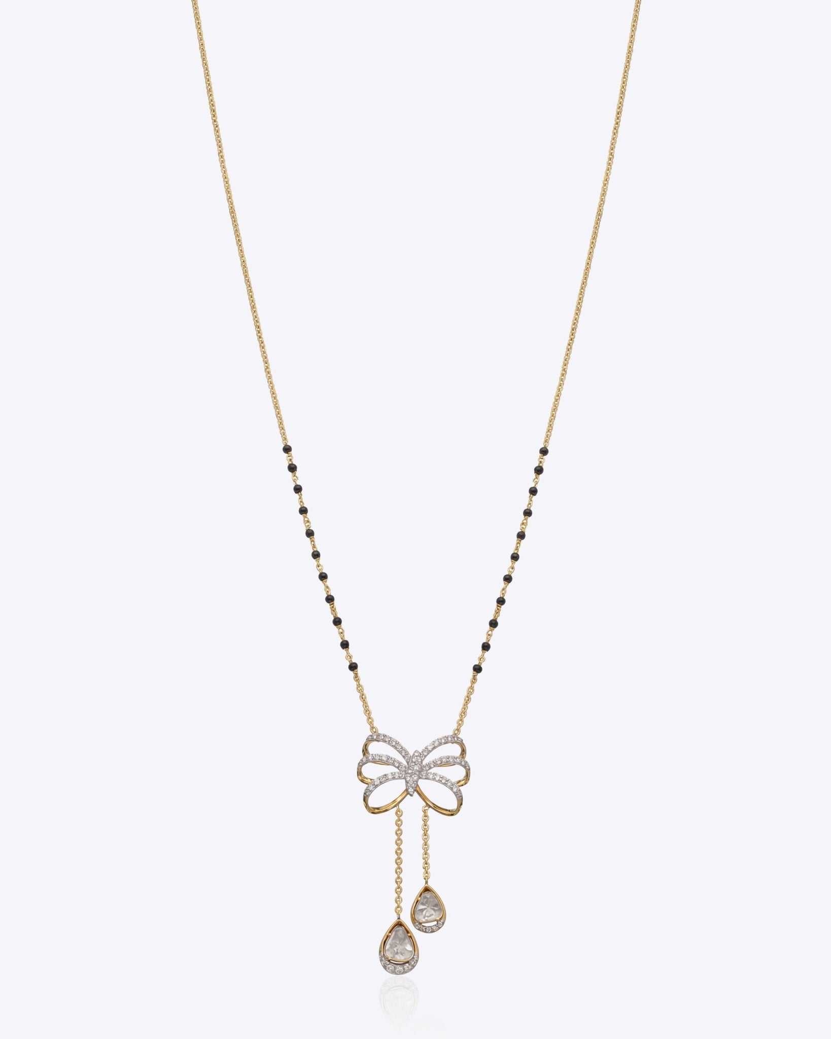 14K gold mangalsutra with Polki detailing and onyx accents