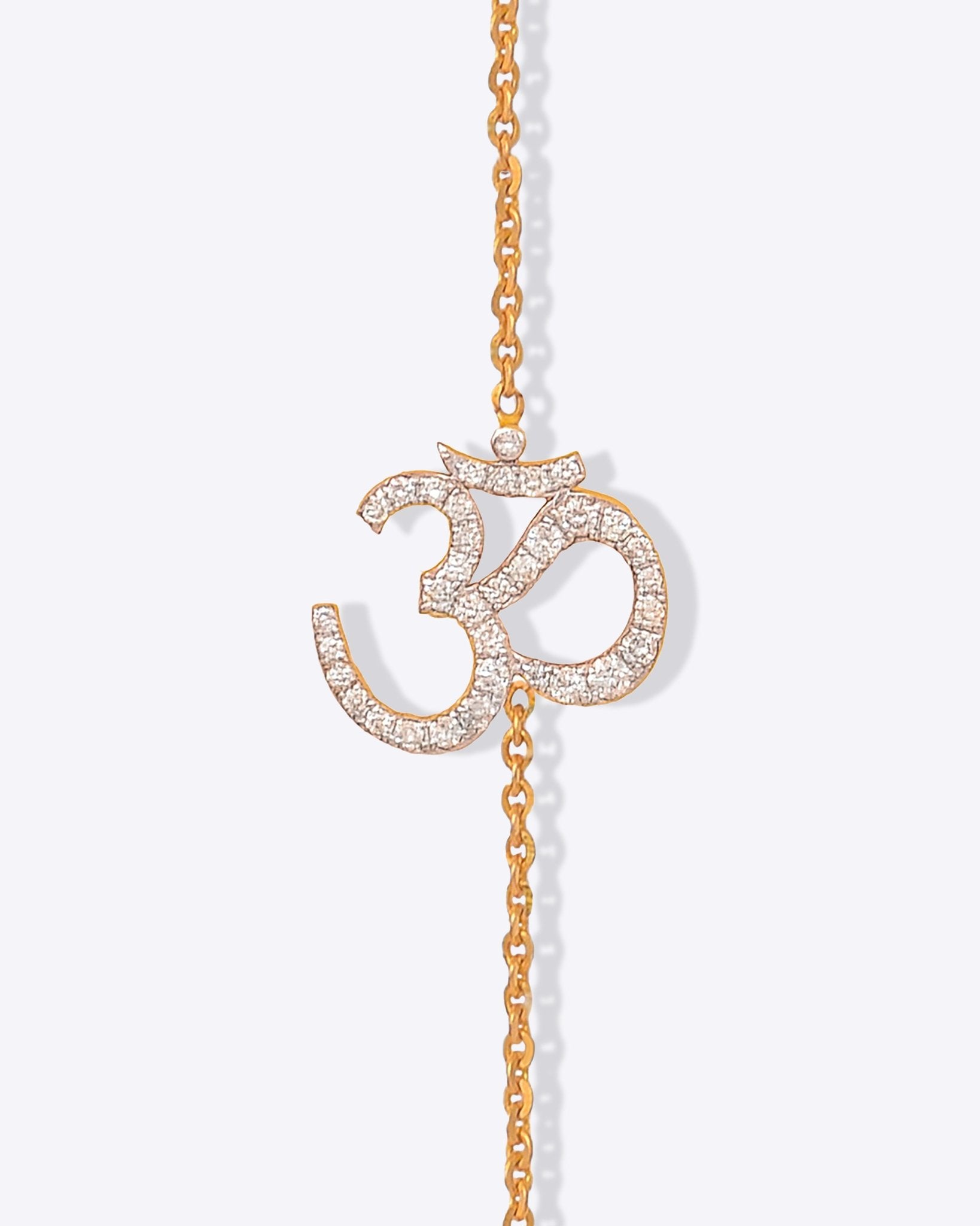 Veer Diamond Bracelet in 14K gold with Om motif and Polki diamond detailing.