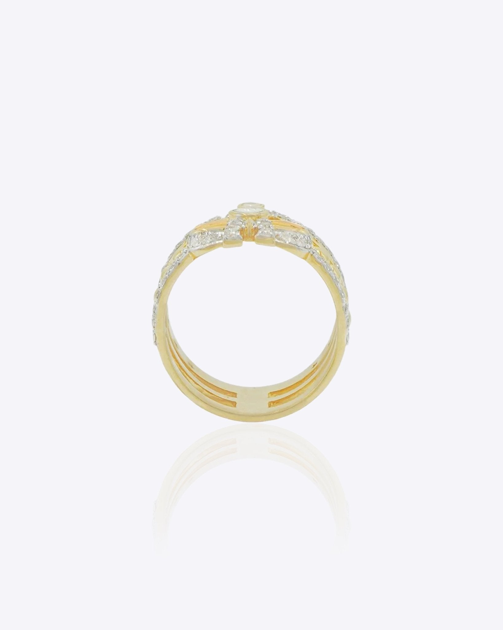 14K gold plated ring with diamond-lined layered bands and a sculpted bow centerpiece.