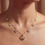 18K gold Navratna Bloom necklace with a radiant bloom and delicate drops.