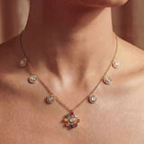 18K gold Navratna Bloom necklace with a radiant bloom and delicate drops.