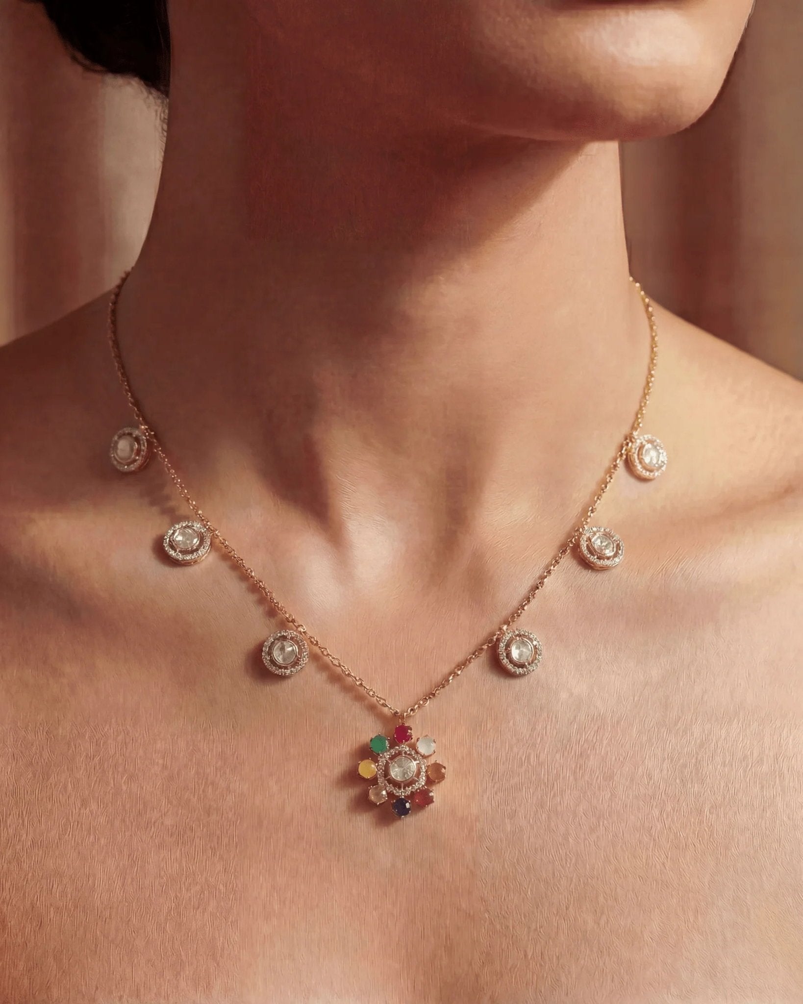 18K gold Navratna Bloom necklace with a radiant bloom and delicate drops.