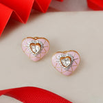 18K gold heart-shaped stud earrings with pink tones and Polki center