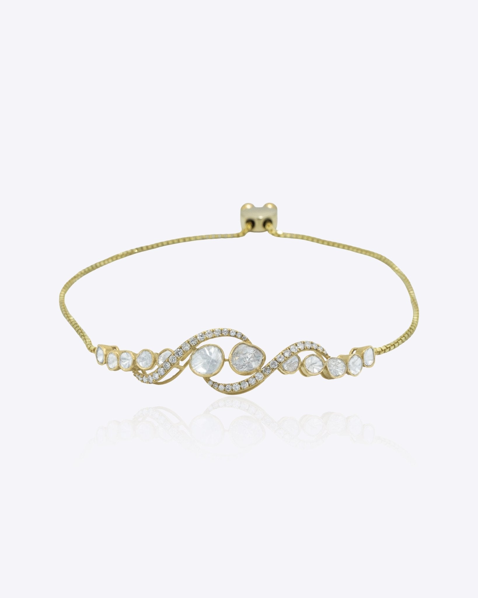 Sylvara Curve Bracelet in 14K gold with sparkling Polki stones along a graceful curve.