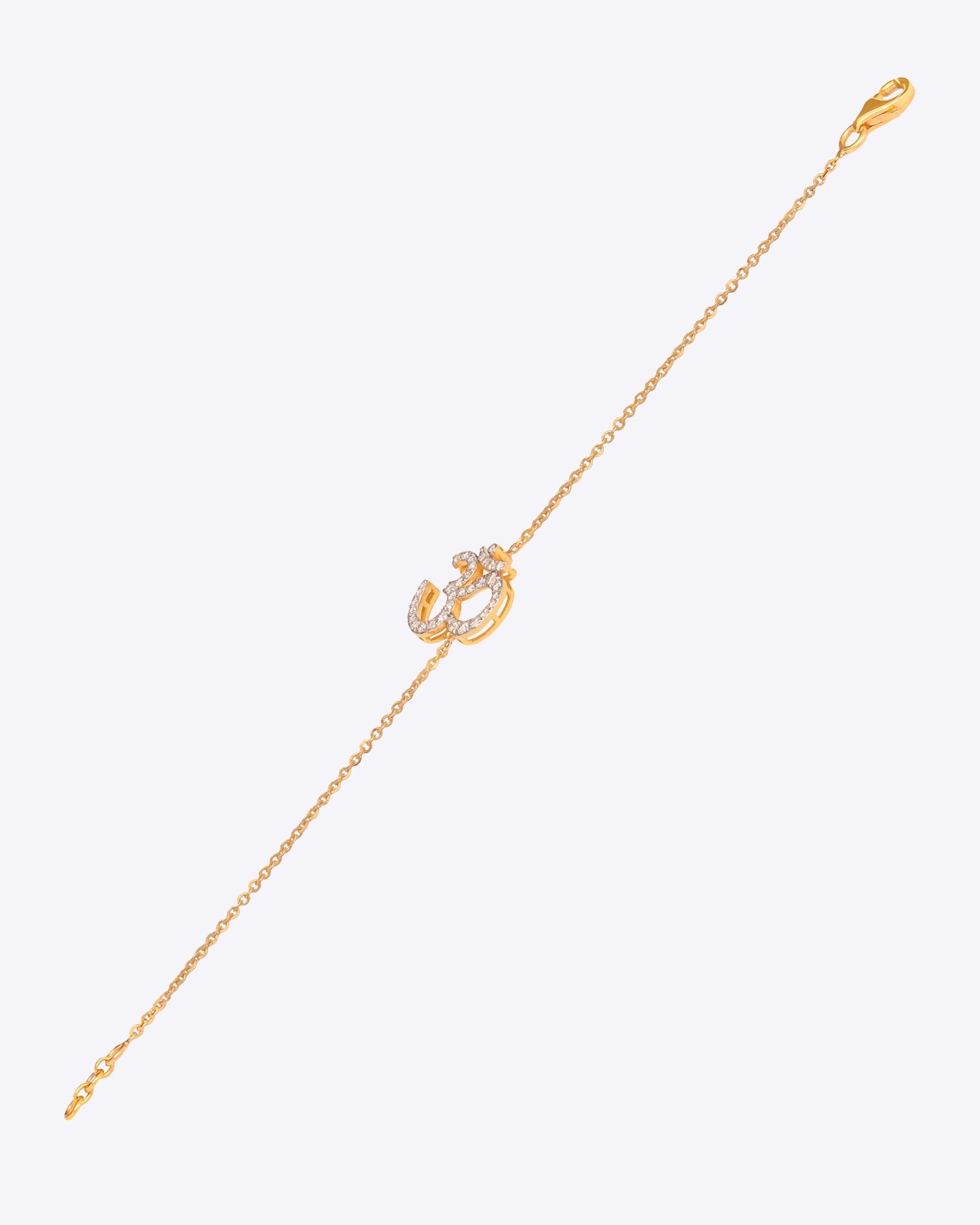 Veer Diamond Bracelet in 14K gold with Om motif and Polki diamond detailing.