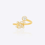 Swastik Sutra Ring in 14K gold with a Polki and diamond-studded Swastik motif.