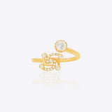 Swastik Sutra Ring in 14K gold with a Polki and diamond-studded Swastik motif.